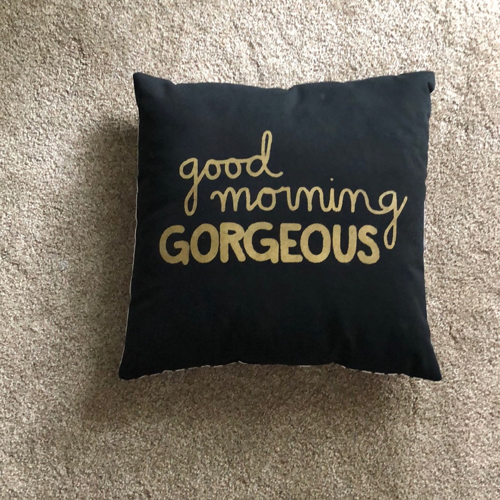 Gold and black striped pillow
